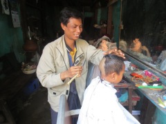 A head shave in preparation to becoming a monk