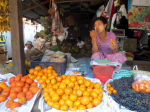 Vendor in market with thanakha paste on her face